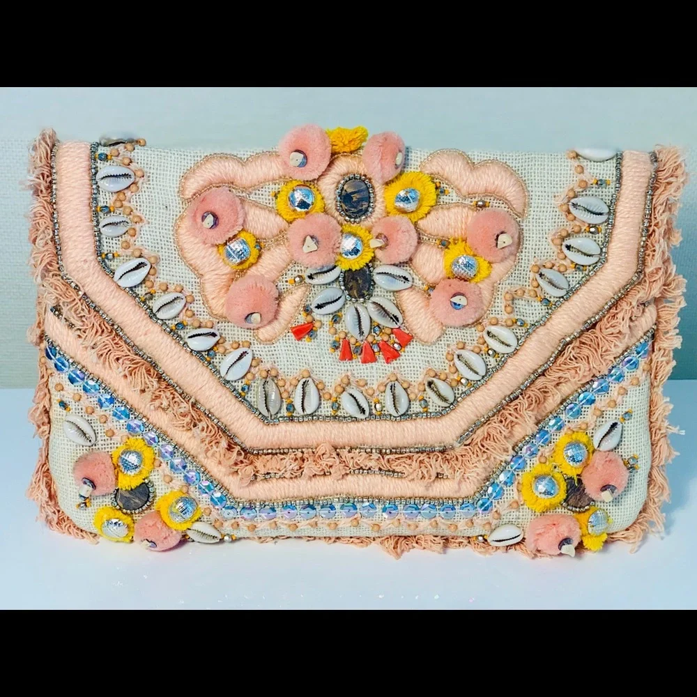 Canvas clutch with coral‎ and yellow pom-poms